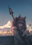  1girl absurdres angelina_(arknights) animal_ears arknights bangs black_gloves blue_sky brown_eyes brown_hair building chen_bin chinese_commentary city clouds commentary_request day fox_ears gloves grey_jacket hair_between_eyes hairband highres holding holding_paper jacket long_hair long_sleeves outdoors paper partial_commentary red_hairband sky smile solo staff upper_body 