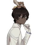  1boy arjuna_(fate/grand_order) bangs black_hair dark_skin dark_skinned_male fate/grand_order fate_(series) gloves hair_between_eyes hand_on_own_face long_sleeves looking_at_viewer male_focus on_head orion_(fate/grand_order) rozu_ki solo stuffed_animal stuffed_toy teddy_bear white_background white_gloves 