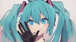  1girl absurdres against_fourth_wall aqua_eyes aqua_hair black_gloves commentary gloves hand_up hatsune_miku headphones headset highres long_hair looking_up portrait shitoo smile twintails vocaloid 