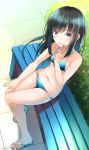  1girl alternate_costume asashio_(kantai_collection) bangs bare_arms bare_legs bare_shoulders bench bikini black_hair blue_bikini blue_eyes blush breasts comah commentary_request eyebrows_visible_through_hair highres kantai_collection long_hair looking_at_viewer navel open_mouth outdoors popsicle_stick sandals side-tie_bikini sitting small_breasts smile solo striped striped_bikini swimsuit 