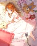  1girl barefoot blue_eyes bottle bow brown_hair chain dress hami_yura highres lying mouth_hold on_bed on_side pill pillow rabbit spill stuffed_animal stuffed_toy teddy_bear white_dress 