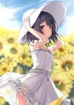  1girl arms_up bangs black_hair blurry blurry_background blush closed_mouth commentary day depth_of_field dress eluthel eyebrows_visible_through_hair flower frilled_dress frills hat highres idolmaster idolmaster_shiny_colors morino_rinze outdoors petals red_eyes see-through see-through_sleeves short_sleeves solo standing sun_hat sundress sunflower twitter_username white_dress white_headwear yellow_flower 