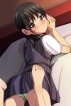  1girl absurdres bangs barefoot bed black_hair black_skirt black_vest blush brown_eyes closed_mouth dutch_angle eyebrows_visible_through_hair from_behind green_panties hands_together highres indoors legs_up long_hair looking_at_viewer looking_back lying matsunaga_kouyou nose_blush on_bed on_stomach original own_hands_together panties shirt short_sleeves skirt smile solo striped striped_vest toes underwear vertical-striped_skirt vertical-striped_vest vertical_stripes vest white_shirt 