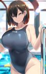  1girl black_hair breasts commentary_request competition_swimsuit cowboy_shot grey_swimsuit highres huge_breasts indoors lens_flare looking_at_viewer one-piece_swimsuit orange_eyes original pool pool_ladder shiki_(psychedelic_g2) short_hair solo swimsuit wet wet_clothes wet_swimsuit 