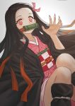  1girl absurdres beige_background black_hair black_haori devil_lo feet_out_of_frame fingernails gag highres japanese_clothes kamado_nezuko kimetsu_no_yaiba kimono long_fingernails long_hair looking_at_viewer multicolored_hair nail_polish obi pink_eyes pink_nails red_eyes redhead ribbon sash solo two-tone_hair very_long_hair 