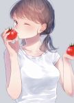  1girl blush breasts brown_hair food grey_background hami_yura holding holding_food looking_at_viewer medium_breasts medium_hair one_eye_closed original shirt short_sleeves simple_background solo tomato twintails upper_body white_shirt 