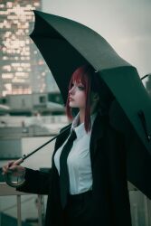  1girl absurdres black_coat black_necktie black_pants black_umbrella blunt_bangs braid braided_ponytail breasts building chainsaw_man city_lights closed_mouth coat collared_shirt commentary_request cosplay cosplay_photo demon_girl expressionless fingernails formal_clothes from_side hand_on_railing hand_up high-waist_pants highres holding holding_umbrella kei_0220 long_coat long_fingernails long_hair long_sidelocks looking_ahead makima_(chainsaw_man) mature_female medium_breasts necktie nose office_lady open_clothes open_coat outdoors pale_skin pants photo_(medium) photoshop_(medium) pink_lips raised_eyebrows real_life red_hair ringed_eyes shirt shirt_tucked_in sidelocks single_braid solo standing umbrella upper_body white_shirt wing_collar yellow_eyes 