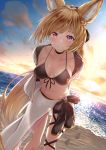  1girl animal_ears arms_behind_back beach bikini black_bikini blonde_hair bow breasts erune granblue_fantasy highres hisei medium_breasts navel ocean pink_eyes ponytail sarong smile swimsuit twilight yuisis_(granblue_fantasy) 