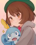  1girl bangs brown_eyes brown_hair closed_mouth commentary english_commentary eyebrows_visible_through_hair gen_8_pokemon green_headwear grey_hoodie hat looking_at_viewer notice_lines pink_background pokemon pokemon_(game) pokemon_swsh short_hair signature simple_background smile sobble tam_o&#039;_shanter temachii yuuri_(pokemon) 