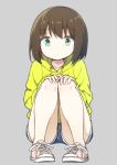  1girl brown_hair chintara10 denim denim_shorts full_body green_eyes grey_background hands_on_own_knees long_sleeves looking_at_viewer original pink_footwear shoes short_shorts shorts simple_background solo squatting yellow_hoodie 