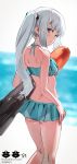  1girl ass bikini bikini_skirt brown_eyes frilled_bikini frills from_behind green_bikini grey_hair harusame_tsubaki kantai_collection kasumi_(kantai_collection) long_hair looking_at_viewer looking_back side_ponytail solo swimsuit torpedo 