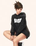  1girl black_nails brown_eyes brown_hair casual crossed_legs hood hood_down hoodie invisible_chair jewelry lips overwatch ring short_hair sitting smile solo spiky_hair tracer_(overwatch) twitter_username umigraphics zipper_pull_tab 