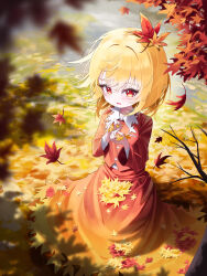  1girl absurdres aki_shizuha autumn autumn_leaves blonde_hair blurry blurry_foreground blush branch breast_pocket breasts buttons collared_shirt commentary_request day full_body hair_between_eyes hair_ornament hands_up highres holding holding_leash leaf leash long_skirt long_sleeves looking_at_viewer maple_leaf maple_leaf_hair_ornament medium_breasts open_mouth orange_skirt outdoors pocket red_eyes red_shirt red_skirt river sana_(sanapri11) shadow shirt short_hair skirt skirt_set solo standing touhou tree two-tone_skirt white_shirt wide_sleeves 