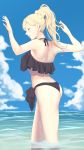  1girl alternate_hairstyle ass bare_legs bikini black_bikini blonde_hair blue_eyes clouds day feet_out_of_frame high_ponytail highres kantai_collection long_hair mole mole_under_eye mole_under_mouth ocean partially_submerged richelieu_(kantai_collection) shingyo sky smile solo swimsuit water 