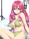  1girl arm_support bangs bikini breasts character_request commentary_request ears eyebrows_visible_through_hair frilled_bikini frills green_bikini hair_between_eyes ino large_breasts long_hair looking_at_viewer navel on_bed pink_hair red_eyes sideboob sitting smile solo string_bikini striped striped_bikini swimsuit under_boob very_long_hair wavy_hair white_background 