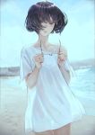  1girl bangs beach black_eyes black_hair blue_sky blurry blurry_background bob_cut building collarbone footprints glasses highres holding holding_eyewear looking_at_viewer no_pants ocean off-shoulder_shirt off_shoulder original outdoors parted_lips sand see-through shirt short_hair short_sleeves sky solo strap water white_shirt yasukura_(shibu11) 