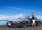  1girl 3books absurdres blue_eyes car eyebrows_visible_through_hair glasses grey_hair ground_vehicle highres looking_to_the_side motor_vehicle nissan_s13_silvia ocean original short_hair solo tail vehicle_focus 