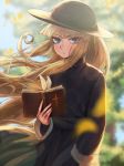 1girl bangs bible black_dress black_headwear blonde_hair blue_eyes blurry blurry_background blurry_foreground book character_request closed_mouth day dress eyebrows_visible_through_hair floating_hair frown hat highres holding lens_flare long_hair long_sleeves looking_at_viewer milmir open_book outdoors solo standing sun_hat very_long_hair yuu-gi-ou 
