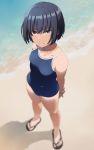  1girl arms_behind_back beach black_hair blurry day depth_of_field from_above mattaku_mousuke ocean original outdoors sandals school_swimsuit shirt_tan short_hair solo swimsuit tan tanline watermark 