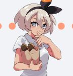  1girl :t bag bangs bea_(pokemon) blush bow_hairband circle closed_mouth collared_shirt commentary_request eyelashes grey_eyes grey_hair hair_between_eyes hairband hand_up holding holding_bag looking_at_viewer paper_bag pokemon pokemon_(game) pokemon_swsh shirt short_hair short_sleeves solo tamakibi upper_body white_shirt 