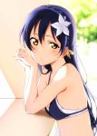  1girl bangs bikini blue_bikini blue_hair blush braid crown_braid elbows_on_table flower from_side hair_between_eyes hair_flower hair_ornament hands_together head_rest highres long_hair looking_at_viewer love_live! love_live!_school_idol_project reno_0901 solo sonoda_umi swimsuit upper_body white_flower yellow_eyes 