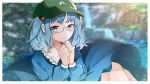  1girl bangs bespectacled blue_eyes blue_hair blue_shirt blurry blurry_background collared_shirt eyelashes flat_cap frilled_shirt_collar frills glasses hair_bobbles hair_ornament hands_on_own_chest hat highres hyaku_paasento kawashiro_nitori long_sleeves looking_at_viewer medium_hair puffy_sleeves round_eyewear shirt short_twintails sidelocks smile solo touhou twintails two_side_up water waterfall 