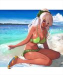  1girl beach bikini bow breasts dark_skin green_bikini green_bow hair_bow highres large_breasts long_hair looking_to_the_side mole mole_on_breast mole_under_eye ocean open_mouth original pupps sandals seiza sitting solo summer swimsuit tied_hair violet_eyes white_hair 