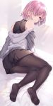  1girl arm_support artist_name backlighting bed bed_sheet black_legwear black_shirt black_skirt commentary fate/grand_order fate_(series) from_behind grey_shirt hair_over_one_eye highres hood hoodie indoors kuroki_(ma-na-tu) legs light_particles long_sleeves looking_at_viewer looking_back lying mash_kyrielight miniskirt off_shoulder on_bed on_side pantyhose parted_lips pillow pink_hair pleated_skirt shirt short_hair signature skirt sleeveless sleeveless_shirt solo violet_eyes window 
