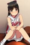  1girl absurdres bangs bare_arms bare_shoulders basketball basketball_uniform black_hair blush bow brown_eyes closed_mouth eyebrows_visible_through_hair hair_bow highres indoors knees_together_feet_apart knees_up long_hair looking_at_viewer matsunaga_kouyou nose_blush on_floor original purple_bow shirt shoes short_shorts shorts sitting sleeveless sleeveless_shirt smile socks solo sportswear white_footwear white_legwear white_shirt white_shorts wooden_floor 