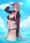  1girl ahoge bikini black_bikini black_choker black_gloves black_jacket blue_sky choker clouds cropped_jacket fate/grand_order fate_(series) fuaru gloves highres jacket jeanne_d&#039;arc_(alter_swimsuit_berserker) jeanne_d&#039;arc_(fate)_(all) long_hair navel o-ring o-ring_bikini o-ring_bottom o-ring_top ocean shrug_(clothing) silver_hair sky swimsuit very_long_hair wading waves yellow_eyes 