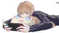  1boy black_shirt blonde_hair blue_eyes character_doll character_pillow commentary_request covered_mouth fura_kanato fura_kanato_(1st_costume) hair_between_eyes handheld_game_console highres holding holding_handheld_game_console kashitsuki_(tashikaniaruki) long_sleeves lying male_focus multicolored_eyes multicolored_hair nijisanji nintendo_switch omanjuu_mascot on_stomach orange_hair pillow shirt short_hair simple_background sleeves_past_wrists solo streaked_hair violet_eyes virtual_youtuber white_background 
