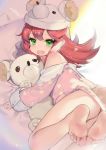  1girl acidear animal_hat ash_arms blush embarrassed fang feet green_eyes hair_between_eyes hat highres lying maus_(ash_arms) medium_hair on_side open_mouth pajamas redhead solo stuffed_animal stuffed_toy 