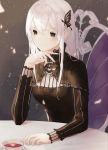  1girl bangs black_capelet black_dress black_eyes capelet closed_mouth cup dress echidna_(re:zero) hair_between_eyes hair_ornament highres long_hair long_sleeves re:zero_kara_hajimeru_isekai_seikatsu silver_hair sitting smile solo straight_hair teacup upper_body worl_a 