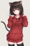  1girl animal_ear_fluff animal_ears anz32 bangs black_legwear blush breasts brown_eyes brown_hair cat_ears cat_girl cat_tail closed_mouth clothes_writing commentary_request drawstring eyebrows_visible_through_hair grey_background hair_between_eyes hands_up hood hood_down hoodie long_hair long_sleeves looking_at_viewer original red_hood sleeves_past_wrists small_breasts solo standing tail thigh-highs twitter_username 