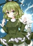  1girl blue_background blush dress electricity ghost_tail green_dress green_eyes green_hair hat highres index_finger_raised juliet_sleeves long_sleeves looking_at_viewer puffy_sleeves ruu_(tksymkw) soga_no_tojiko solo tate_eboshi touhou 
