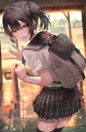  1girl backpack bag bent_over black_hair black_legwear blush hair_tie highres indoors kinoruru_toiro looking_at_viewer medium_hair original school_uniform short_twintails side_ponytail sidelocks skirt solo standing thigh-highs twintails yellow_eyes 