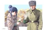  1boy 1girl belt blanket blue_hair border closed_mouth coat collared_coat cup dated forest fur_hat green_coat hair_bun hammer_and_sickle hat holding holding_cup horikou long_sleeves looking_at_viewer military_coat mug nature real_life shima_rin signature smile soldier soviet_army ushanka violet_eyes white_border yurucamp 