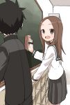  1boy 1girl :d absurdres bangs black_hair black_jacket black_pants black_sailor_collar black_skirt blush brown_eyes brown_hair chalkboard classroom_eraser commentary_request facing_away gakuran highres indoors jacket karakai_jouzu_no_takagi-san locker long_hair long_sleeves looking_at_another looking_to_the_side nishikata official_art open_mouth pants parted_bangs pleated_skirt sailor_collar school_uniform serafuku shirt skirt smile standing takagi-san white_shirt yamamoto_souichirou 