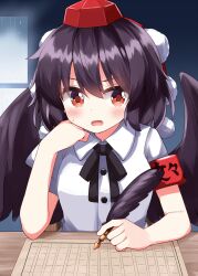  1girl armband bird_wings black_hair black_ribbon black_wings blush breasts buttons collared_shirt commentary_request feather_nib_pen feathered_wings feathers hand_on_own_cheek hand_on_own_face hat highres holding holding_feather neck_ribbon nib_pen_(object) open_mouth pen pom_pom_(clothes) red_eyes red_hat ribbon ruu_(tksymkw) shameimaru_aya shirt short_hair short_sleeves single_feather small_breasts solo table tokin_hat touhou translation_request upper_body white_shirt wings 