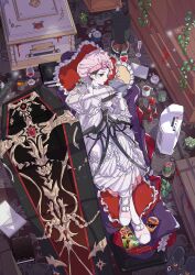  1girl absurdres alarm_clock alternate_costume arknights bag_of_chips bible_(object) black_wings clock coffin commentary_request cup dal-gi drinking_glass entelechia_(arknights) full_body highres in_coffin indoors korean_commentary nightgown pale_skin parted_lips pillow pointy_ears red_eyes slippers solo white_nightgown wine_glass wings 