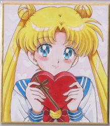  1girl bishoujo_senshi_sailor_moon blonde_hair blue_eyes blue_sailor_collar blue_trim blush bow box box_of_chocolates brown_ribbon chikoto_(kztc4472) closed_mouth commentary double_bun earrings hair_bun hands_up heart heart-shaped_box heart_background highres holding holding_box jewelry lips lone_nape_hair long_hair long_sleeves looking_at_viewer parted_lips photo_(medium) picture_frame pink_background red_bow ribbon sailor_collar school_uniform serafuku shirt smile solo traditional_media transformation_brooch_(sailor_moon) tsukino_usagi upper_body valentine white_shirt 