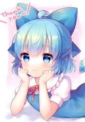  1girl absurdres ahoge blue_bow blue_dress blue_eyes blue_hair blush border bow cirno closed_mouth coa_(chroo_x) collared_shirt crossed_bangs dress frilled_shirt_collar frills hair_between_eyes hair_bow head_rest highres ice ice_wings looking_at_viewer lying neck_ribbon on_stomach outside_border pinafore_dress pink_background red_ribbon ribbon shirt short_hair short_sleeves sleeveless sleeveless_dress smile solo thank_you third-party_source touhou upper_body white_border white_shirt wings 