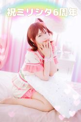  1girl bedroom brown_eyes brown_hair closed_mouth commentary_request cosplay cosplay_photo hands_up happiness_roomwear_(idolmaster) highres idolmaster idolmaster_million_live! idolmaster_million_live!_theater_days indoors kasuga_mirai kasuga_mirai_(cosplay) looking_at_viewer no_shoes on_bed one_side_up pajamas pantyhose photo_(medium) pillow rainbow real_life shirt short_sleeves shorts sitting solo translation_request voice_actor voice_actor_connection wariza yamazaki_haruka 
