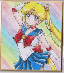  1girl arm_up back_bow bishoujo_senshi_sailor_moon blonde_hair blue_eyes blue_sailor_collar blue_skirt bow breasts bubble_background chikoto_(kztc4472) choker closed_mouth collarbone commentary cowboy_shot crescent crescent_choker crescent_earrings double_bun earrings elbow_gloves gem gloves gold_tiara hair_bun hair_ornament highres jewelry leotard light_smile lone_nape_hair long_hair looking_at_viewer magical_girl medium_breasts miniskirt parted_bangs photo_(medium) picture_frame pleated_skirt rainbow_background red_bow red_choker red_gem red_trim sailor_collar sailor_moon sailor_senshi_uniform short_sleeves skirt solo sparkle standing tiara traditional_media transformation_brooch_(sailor_moon) tsukino_usagi twintails very_long_hair white_gloves white_leotard 