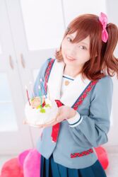 1girl birthday_cake blue_skirt brown_eyes brown_hair cake commentary_request cosplay cosplay_photo food grey_shirt grin happy_birthday highres holding holding_cake holding_food idolmaster idolmaster_million_live! idolmaster_million_live!_theater_days indoors junior_high_schoolmate_(idolmaster) kasuga_mirai kasuga_mirai_(cosplay) long_sleeves looking_at_viewer medium_hair one_side_up photo_(medium) pleated_skirt real_life sailor_collar sailor_shirt shirt skirt smile solo standing teeth voice_actor voice_actor_connection white_sailor_collar yamazaki_haruka 