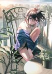  1girl ahoge black_hair blue_eyes blue_jacket blush building chair closed_mouth highres jacket jacket_on_shoulders knee_up koh_rd leaf looking_to_the_side medium_hair original outdoors plant potted_plant shirt sitting sky sleeveless sleeveless_shirt solo table white_shirt 