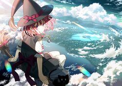  1girl back bangs black_cat black_dress broom broom_riding cat cityscape clouds day dress eyebrows_visible_through_hair hat headwear highres jewelry koh_rd looking_at_viewer medium_hair original pendant pink_hair ribbon scenery short_sleeves sitting sky solo water witch witch_hat 