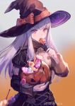  1girl artist_name azutarou black_headwear blush bow buttons candy commentary_request epaulettes eyebrows_visible_through_hair fire_emblem fire_emblem:_three_houses floating_hair food garreg_mach_monastery_uniform hair_between_eyes halloween hat holding holding_candy holding_food jack-o&#039;-lantern licking lollipop long_hair looking_at_viewer lysithea_von_ordelia orange_bow orange_ribbon pink_eyes ribbon solo twitter_username uniform white_hair witch witch_hat 