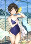  1girl ahoge blue_sky blue_swimsuit brown_eyes brown_hair chain-link_fence cleaning_brush clouds competition_school_swimsuit cowboy_shot day domo1220 fence looking_at_viewer original outdoors school_swimsuit short_hair sky solo standing striped_towel swimsuit 