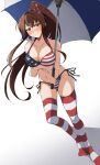  1girl american_flag_bikini asymmetrical_legwear bikini breasts brown_hair cherry_blossoms collarbone flag_print flower full_body hair_flower hair_ornament highres kantai_collection large_breasts leaning_forward long_hair looking_at_viewer nel-c ponytail red_eyes side-tie_bikini simple_background solo standing striped striped_legwear swimsuit thigh-highs umbrella white_background yamato_(kantai_collection) 